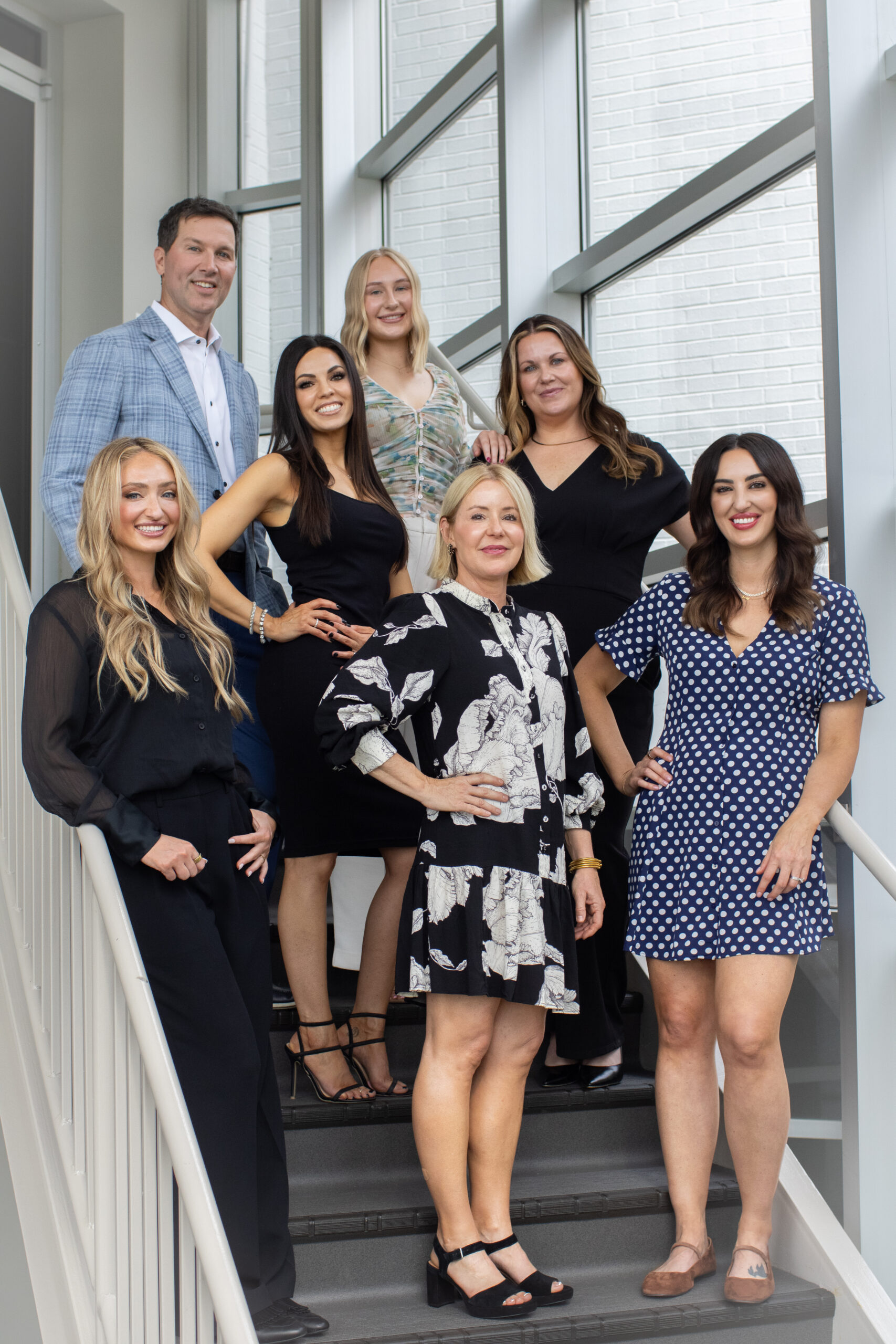 Swann Dermatology providers on the office staircase